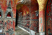 Myanmar, Burma, Nyaungshwe. Small Buddhas set into the temple wall, Shwe Yaunghwe Kyaung monastery, near Inle Lake. 